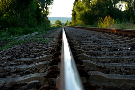 selective focus photography of train rail thumbnail