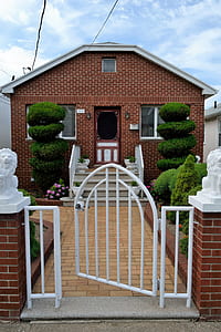 brown concrete house during daytime thumbnail