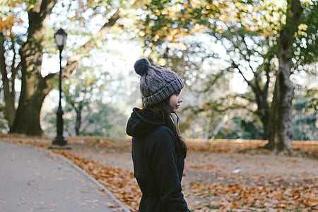 woman standing on gray pavement thumbnail