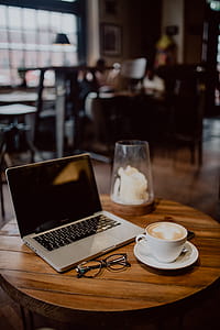 Cup of coffee on table in cafe thumbnail