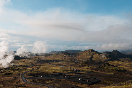 green mountains under cloudy sky thumbnail