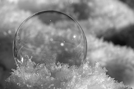close up photography of bubble on snow thumbnail