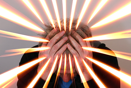 man in black jacket holding his head thumbnail