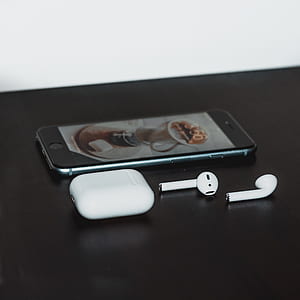 space gray iPhone 6 and AirPods with charging case thumbnail