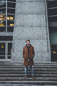 man standing on stairs thumbnail