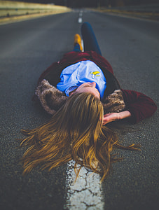 woman lying on road thumbnail