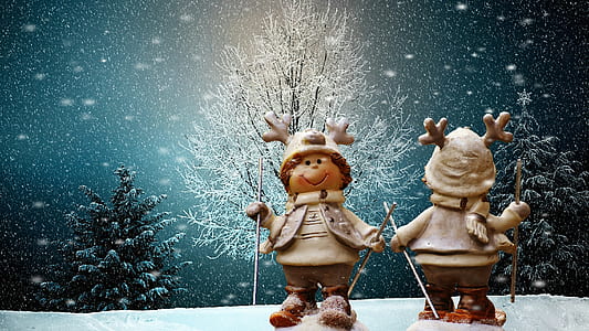 two snowman holding pole during winter season thumbnail
