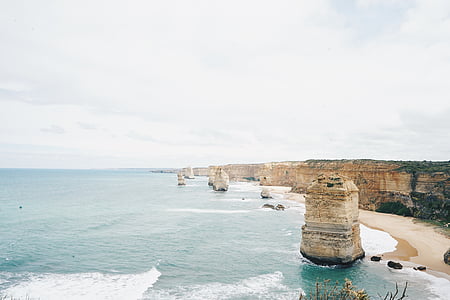 calmly body of water under cloudy sky at daytime thumbnail