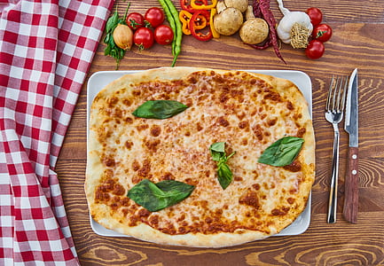 pizza on white ceramic plate thumbnail
