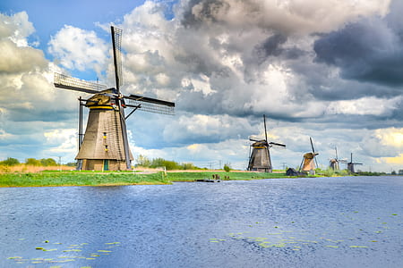 windmill near body of water thumbnail