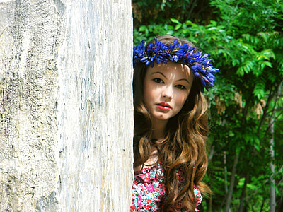 woman wearing purple floral head dress near gray concrete wall thumbnail
