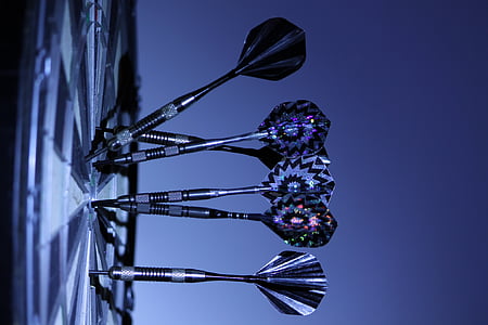 dart board pins pinned on dart board thumbnail