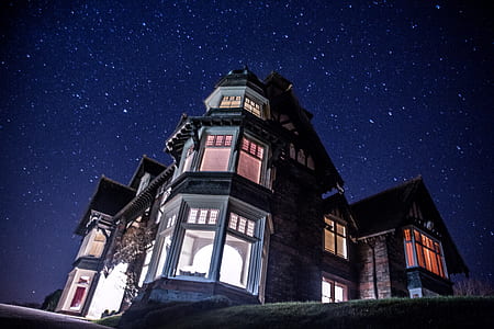concrete house under stars during nighttime thumbnail