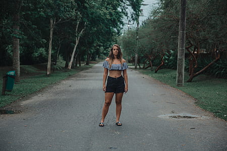 woman standing on road thumbnail