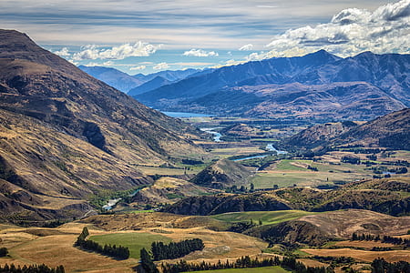 aerial view of river near mountains thumbnail