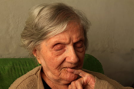 woman sitting down on green seat thumbnail