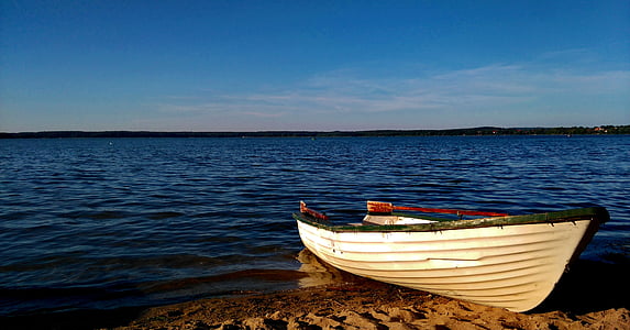 empty boat on seashore thumbnail
