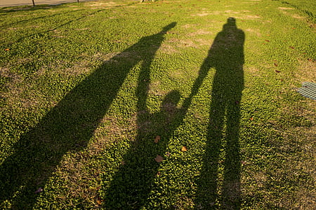 shadow of three people thumbnail