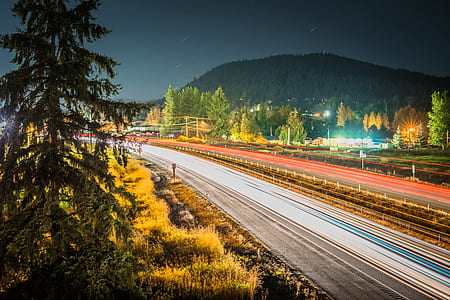 timelapse photography of road and forest thumbnail