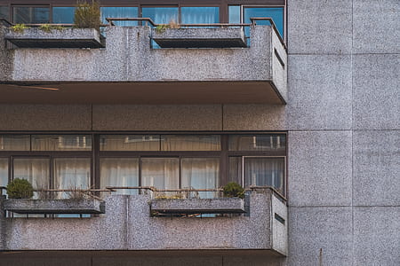 concrete balcony with curtain and plants thumbnail