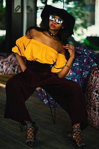 Woman in White Tube Top and Brown Pants thumbnail