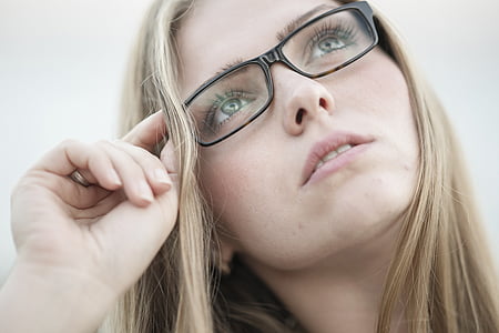 blonde woman with green eyes wearing black framed eyeglasses thumbnail