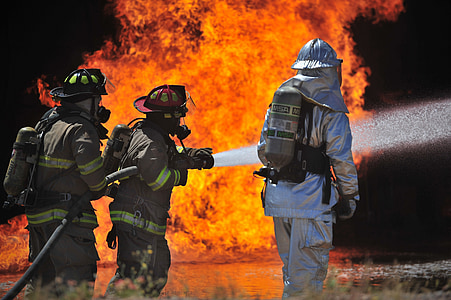 firemen holding hose thumbnail