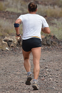 man in white t-shirt and black shorts running on ground thumbnail
