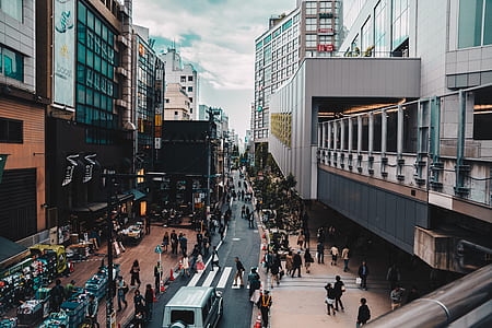 group of people walking on sidewalk and road thumbnail