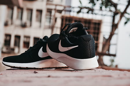 Macro Photography of Pair of Black-and-white Nike Running Shoes thumbnail