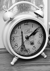 white and black dual bell alarm clock on slab thumbnail