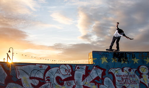man on skateboard grinding on pool edge thumbnail