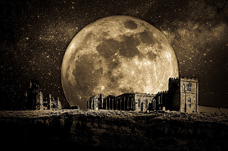 buildings overlooking full moon at nighttime vignette photography thumbnail