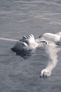 grayscale photography of floating woman thumbnail