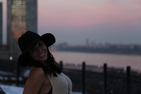 shallow focus photography of woman in white sleeveless top thumbnail