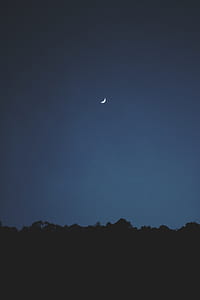 crescent moon during daytime thumbnail