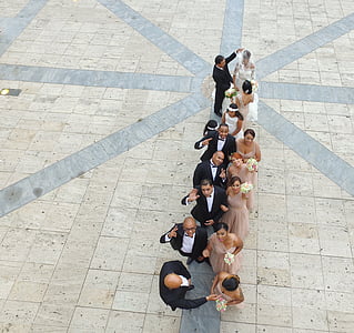 aerial photo of couple and grooms men and brides maid forming line thumbnail