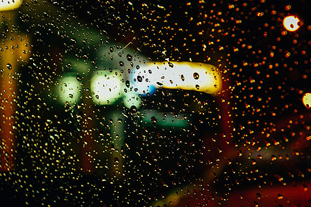 water on glass sheet during nighttime thumbnail