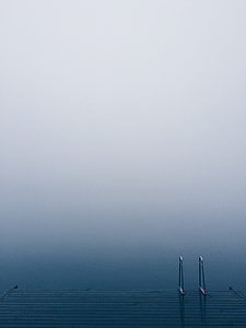 dock near calm sea water thumbnail