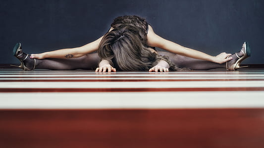 woman stretching on floor thumbnail