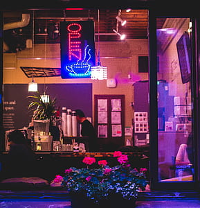 Open LED signage hanged inside cafe thumbnail