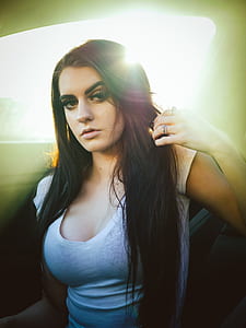 woman sitting holding her hair thumbnail