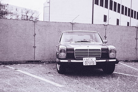 grayscale Mercedes-Benz vehicle with license plate MTK 0719 parked near wall thumbnail
