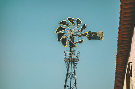 blue and yellow windmill outdoors thumbnail