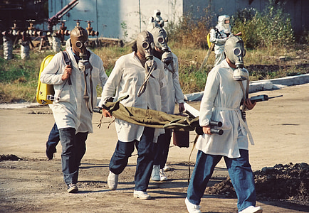 four men wearing brown gas masks thumbnail