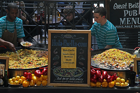 man scooping paella thumbnail