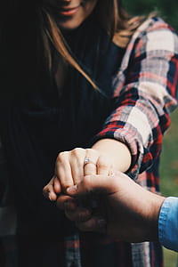 man, woman, hand, holding thumbnail
