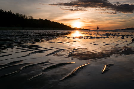 body of water near mountain thumbnail
