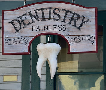gray and red Dentistry Painless signage with tooth decor thumbnail