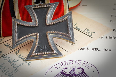 gray 1813 cross medal on white printer paper thumbnail